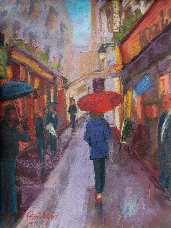 A female wearing blue raincoat and holding a red umbrella walks through the Latin Quarter in Paris in a bold pastel painting by Mary Benke
