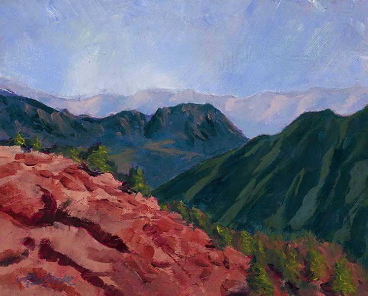 Landscape oil painting of a red ridge leading into green foothills with lavender mountains in the distance by Mary Benke