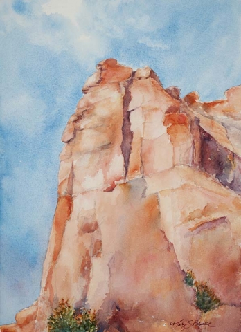 Landscape watercolor painting of a rock formation in Arches National Park, Utah, against a watercolor blue sky by Mary Benke