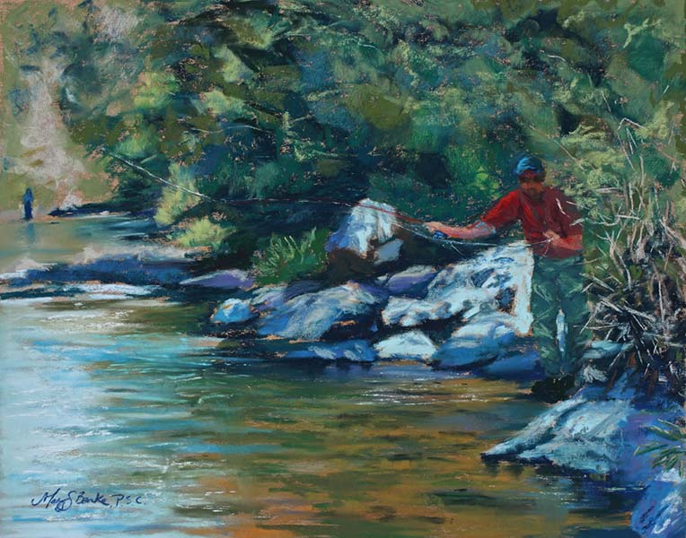 Pastel painting of a fly fisherman casting from a hiding place in the rocks along the shore in a picturesque river by Mary Benke