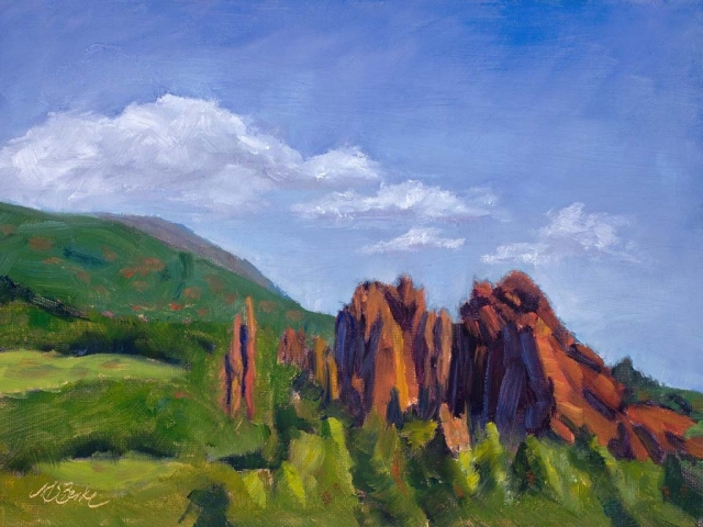 Landscape oil painting of the dramatic red rock formations in Colorado Springs' Garden of the Gods set against brilliant green foothills by Mary Benke