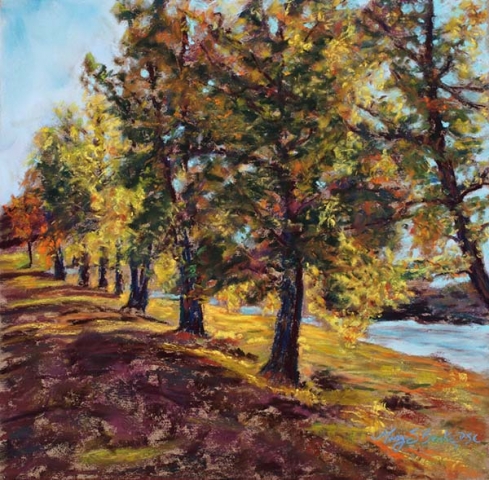 Pastel landscape painting of a row of colorful autumn trees with a river running in the background by Mary Benke