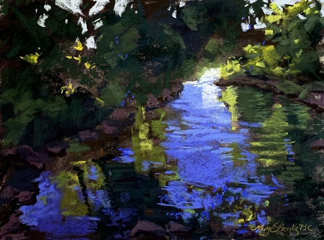 A secluded cove is sheltered by overhanging trees which allow a bit of golden light through to color the reflections in dappled blue water in this peaceful green, blue, and yellow pastel painting by Mary Benke
