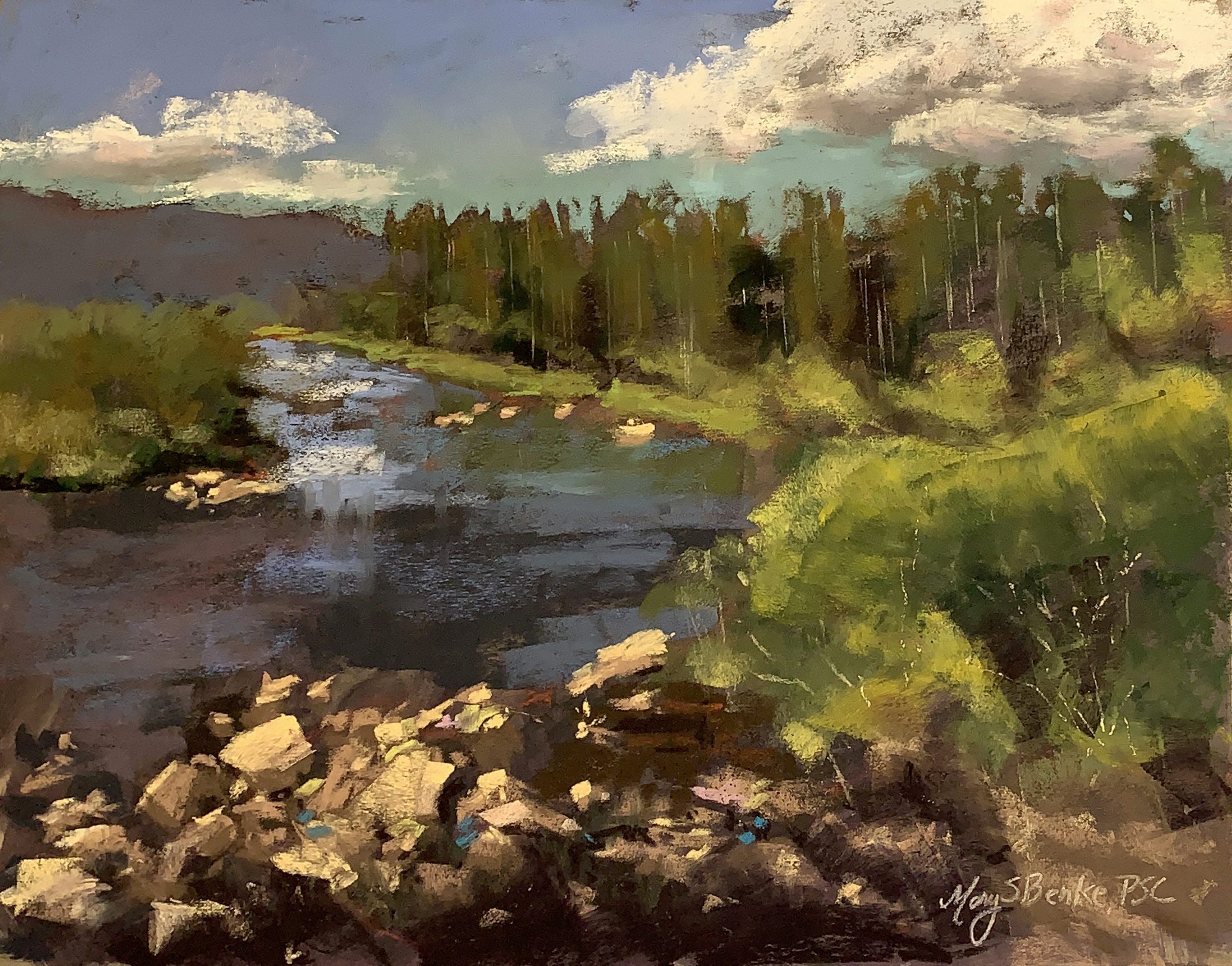 This pastel painting of a river leading toward Shadow Mountain near Grand Lake features a typical spectacular Colorado scene: colorful rocks, lush foliage, distant aspen trees, blue water, a purple mountain and dramatic sky by Mary Benke