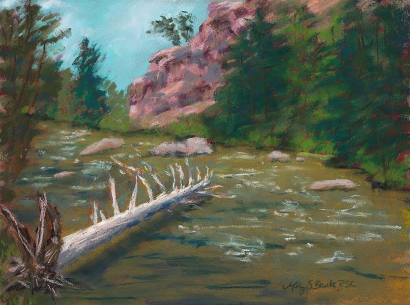 A pastel landscape painting featuring an old, fallen log in a fly fishing river surrounded by trees and dramatic rocks  by Mary Benke