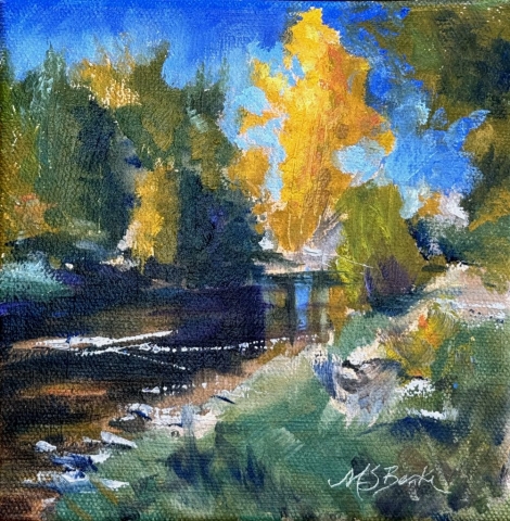 Brushstrokes in various colors capture a vibrant autumn scene featuring a river surrounded by trees with leaves changing colors. The brilliant orange and yellow hues of the foliage stand out against the cool blues of the sky and water, suggesting a crisp, fall atmosphere by Mary Benke